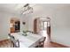 Bright dining room featuring wood floors and a view into the kitchen and front entry at 859 E Bunkerhill Rd, Mooresville, IN 46158