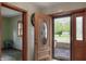 Inviting entryway featuring a wooden door with decorative glass and sidelights at 859 E Bunkerhill Rd, Mooresville, IN 46158