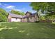 A large front lawn highlights this home's exterior with mature trees and plenty of curb appeal at 859 E Bunkerhill Rd, Mooresville, IN 46158