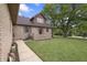A walkway leads to this home's front door with a well-maintained lawn and mature trees at 859 E Bunkerhill Rd, Mooresville, IN 46158