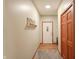 Hallway leads to front door with coat closet and decor shelves at 859 E Bunkerhill Rd, Mooresville, IN 46158