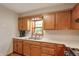 Lovely kitchen showcasing wood cabinets, stainless steel sink, and window at 859 E Bunkerhill Rd, Mooresville, IN 46158