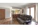 Living room featuring hardwood floors, a brick half-wall, and views of the entryway at 859 E Bunkerhill Rd, Mooresville, IN 46158