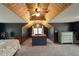 View of main bedroom featuring a vaulted ceiling, ceiling fan and unique railing system at 859 E Bunkerhill Rd, Mooresville, IN 46158
