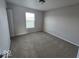 Bedroom featuring neutral walls, carpeted floors, and a window for natural light at 10915 Mansfield Way, Ingalls, IN 46048
