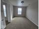 Bedroom featuring neutral walls, carpeted floors, and two windows for plenty of natural light at 10915 Mansfield Way, Ingalls, IN 46048