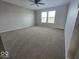 Spacious bedroom featuring two windows with blinds and a ceiling fan with light at 10915 Mansfield Way, Ingalls, IN 46048