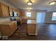 The kitchen is equipped with stainless steel appliances, wooden cabinets and an island at 10915 Mansfield Way, Ingalls, IN 46048
