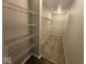 Walk-in closet featuring wire rack shelving and carpeted floor for optimal storage at 10915 Mansfield Way, Ingalls, IN 46048