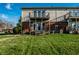 Exterior image of townhome back with balconies and manicured lawn at 11931 E Welland St, Indianapolis, IN 46229
