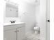 Bright bathroom features modern vanity, new toilet, and neutral walls at 11931 E Welland St, Indianapolis, IN 46229