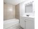 Bright bathroom featuring a tub and shower combination and a vanity with a mirror at 11931 E Welland St, Indianapolis, IN 46229