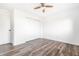 Bedroom featuring wood-look floors, neutral walls and a closet at 11931 E Welland St, Indianapolis, IN 46229