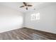 Bedroom with ceiling fan, window, and neutral walls at 11931 E Welland St, Indianapolis, IN 46229