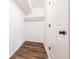 Walk-in closet with new floors and minimalist design, maximizing storage space at 11931 E Welland St, Indianapolis, IN 46229