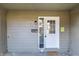 Welcoming entryway with sidelight, clean paint, and modern mailbox at 11931 E Welland St, Indianapolis, IN 46229