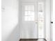 Bright entryway featuring a white door with glass panels and natural light at 11931 E Welland St, Indianapolis, IN 46229