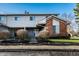 Charming two-story townhouse with brick accents and manicured landscaping at 11931 E Welland St, Indianapolis, IN 46229