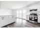 Bright, modern kitchen with stainless steel appliances and breakfast bar near the dining area at 11931 E Welland St, Indianapolis, IN 46229