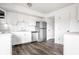 Bright kitchen with stainless steel appliances and white cabinets, blending style and function at 11931 E Welland St, Indianapolis, IN 46229