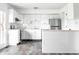 Bright, remodeled kitchen with stainless steel appliances, granite countertops, and ample counterspace at 11931 E Welland St, Indianapolis, IN 46229