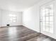 This living room is bright and features hard surface floors and a view of the outside at 11931 E Welland St, Indianapolis, IN 46229