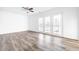Inviting living room with patio doors, offering seamless indoor-outdoor living at 11931 E Welland St, Indianapolis, IN 46229
