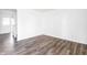 Open living space featuring luxury vinyl plank flooring and an entry door at 11931 E Welland St, Indianapolis, IN 46229