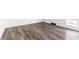 Open living space featuring luxury vinyl plank flooring and a walkout to a patio at 11931 E Welland St, Indianapolis, IN 46229