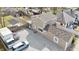 Captivating aerial view of a cozy two-story home with a large gravel parking area at 1231 S Pershing Ave, Indianapolis, IN 46221