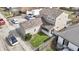 An aerial view showcasing the home's layout, fenced yard, and proximity to the surrounding neighborhood at 1231 S Pershing Ave, Indianapolis, IN 46221