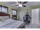 Bedroom features ceiling fan, natural light and attached study area at 1231 S Pershing Ave, Indianapolis, IN 46221