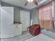 Well-lit bedroom featuring a chair, closet, and natural light from a window at 1231 S Pershing Ave, Indianapolis, IN 46221