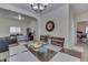 Charming dining area featuring a dark wood table, and open layout that flows seamlessly into the living area at 1231 S Pershing Ave, Indianapolis, IN 46221