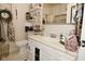 Bright bathroom features a white sink, countertop, toilet, and decorative mirror at 15524 Dusty Trl, Noblesville, IN 46060