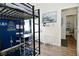 Nicely decorated bedroom featuring a lofted bed, desk, and shark-themed decor at 15524 Dusty Trl, Noblesville, IN 46060