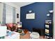 Well-decorated bedroom featuring stylish decor, blue accent wall, and lots of sunlight at 15524 Dusty Trl, Noblesville, IN 46060