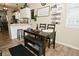 Charming dining area with seating for six, stylish decor, and wood-style flooring creates a warm, inviting atmosphere at 15524 Dusty Trl, Noblesville, IN 46060