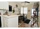 Bright dining area with wood-look floors, stylish decor, and seating for four offers a modern and inviting space at 15524 Dusty Trl, Noblesville, IN 46060