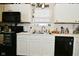 Bright kitchen with modern appliances, white cabinets, and tile backsplash offers a clean, functional cooking space at 15524 Dusty Trl, Noblesville, IN 46060