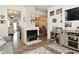 Open-concept living room with a fireplace and connection to the kitchen at 15524 Dusty Trl, Noblesville, IN 46060