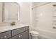 Clean bathroom with a gray vanity, a white countertop, a toilet and a shower with a bathtub at 15628 Allegro Dr, Westfield, IN 46074