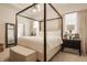 Elegant bedroom features a canopy bed, soft lighting, and neutral decor for a serene retreat at 15628 Allegro Dr, Westfield, IN 46074