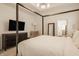 Spacious bedroom features a dark wood dresser and a cozy reading chair for relaxation at 15628 Allegro Dr, Westfield, IN 46074