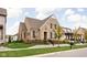 Beautiful brick home with a well-kept lawn, mature trees, and attractive stone retaining wall at 15628 Allegro Dr, Westfield, IN 46074