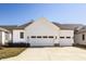 Attractive two-car garage with a well-lit driveway and manicured lawn for curb appeal at 15628 Allegro Dr, Westfield, IN 46074