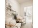 Cozy hallway with beach-themed artwork, seating, and neutral décor creating a tranquil transition space at 15628 Allegro Dr, Westfield, IN 46074