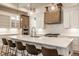 Well-lit kitchen boasts a large island with seating, stainless steel appliances, and stylish pendant lighting at 15628 Allegro Dr, Westfield, IN 46074