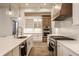 Modern kitchen featuring white cabinets, stainless steel appliances, and an island with a sink at 15628 Allegro Dr, Westfield, IN 46074
