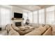 Comfortable living room with a large sectional sofa, fireplace, and ample natural light at 15628 Allegro Dr, Westfield, IN 46074